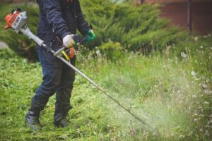 Using a trimmer on missed grass