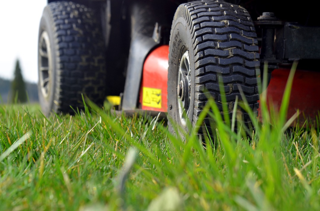Up close shot of a riding lawn mower.